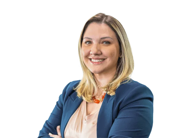 Blonde woman smiling in business attire