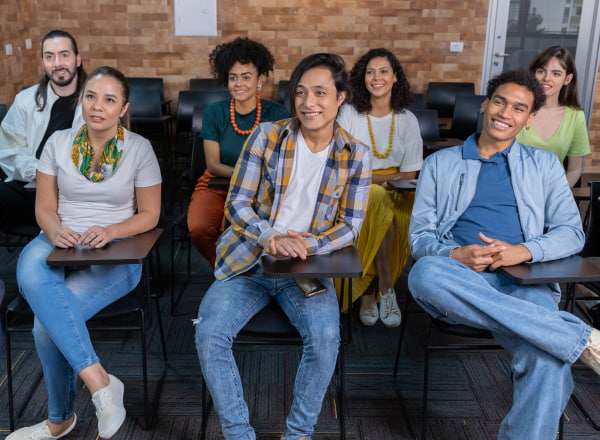 Young people seated in a selection process room